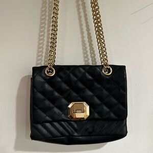 Elegant Black Quilted Bag with Gold Accents